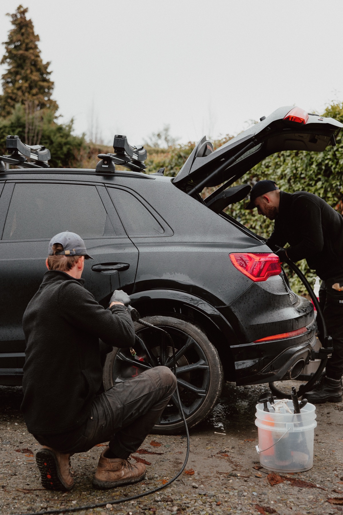 Mason detailing Audi RSQ3 in Queenstown driveway