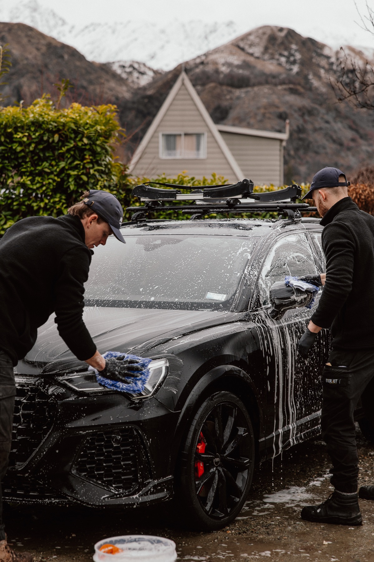 Mason finishing detail work on black Audi in Queenstown