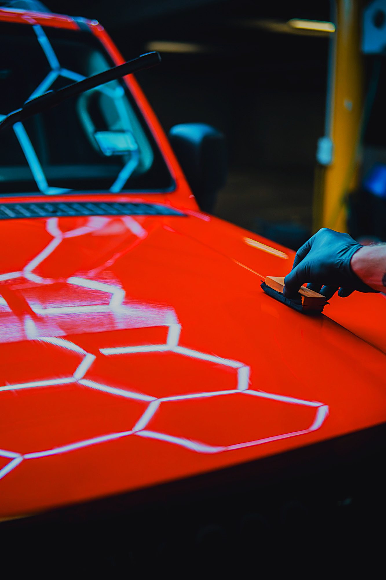 Ceramic coating being applied by hand under the hex lights
