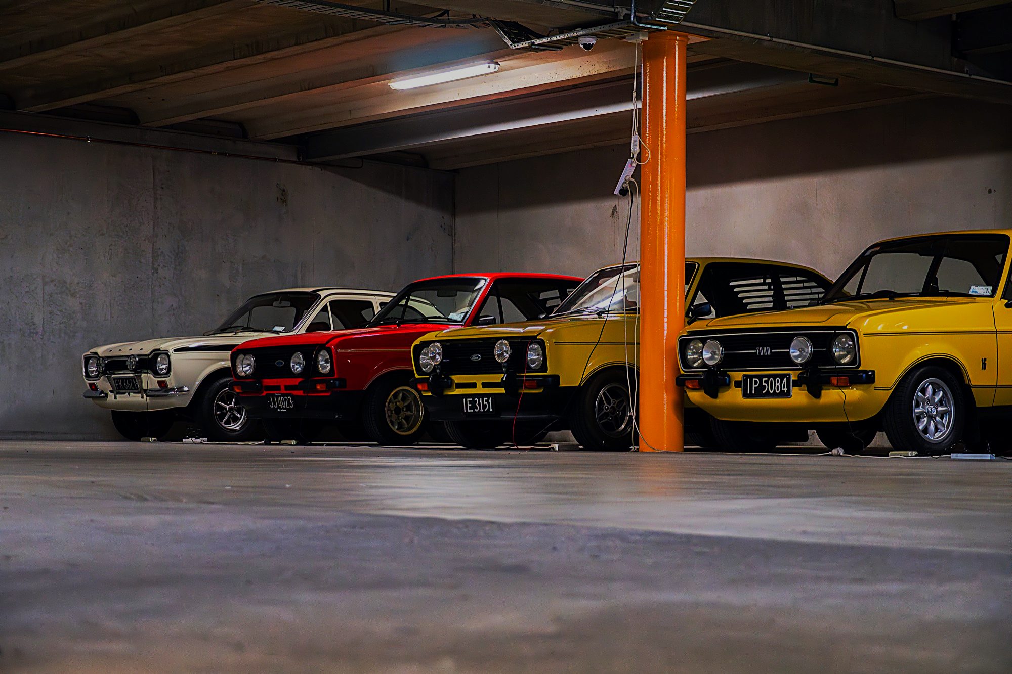 Four classic Ford Escorts stored together
