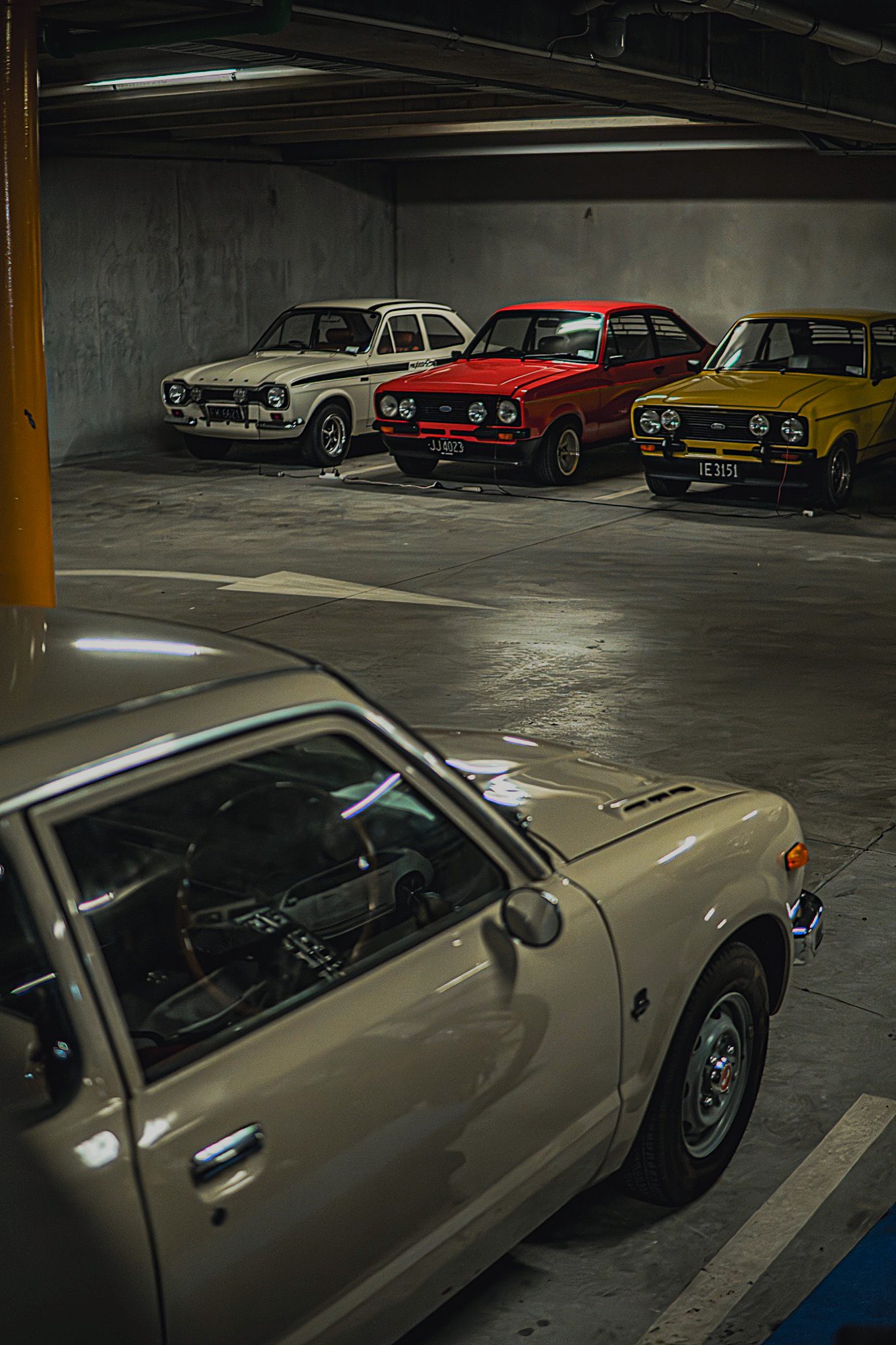 Three classic Escorts and Honda Civic in storage