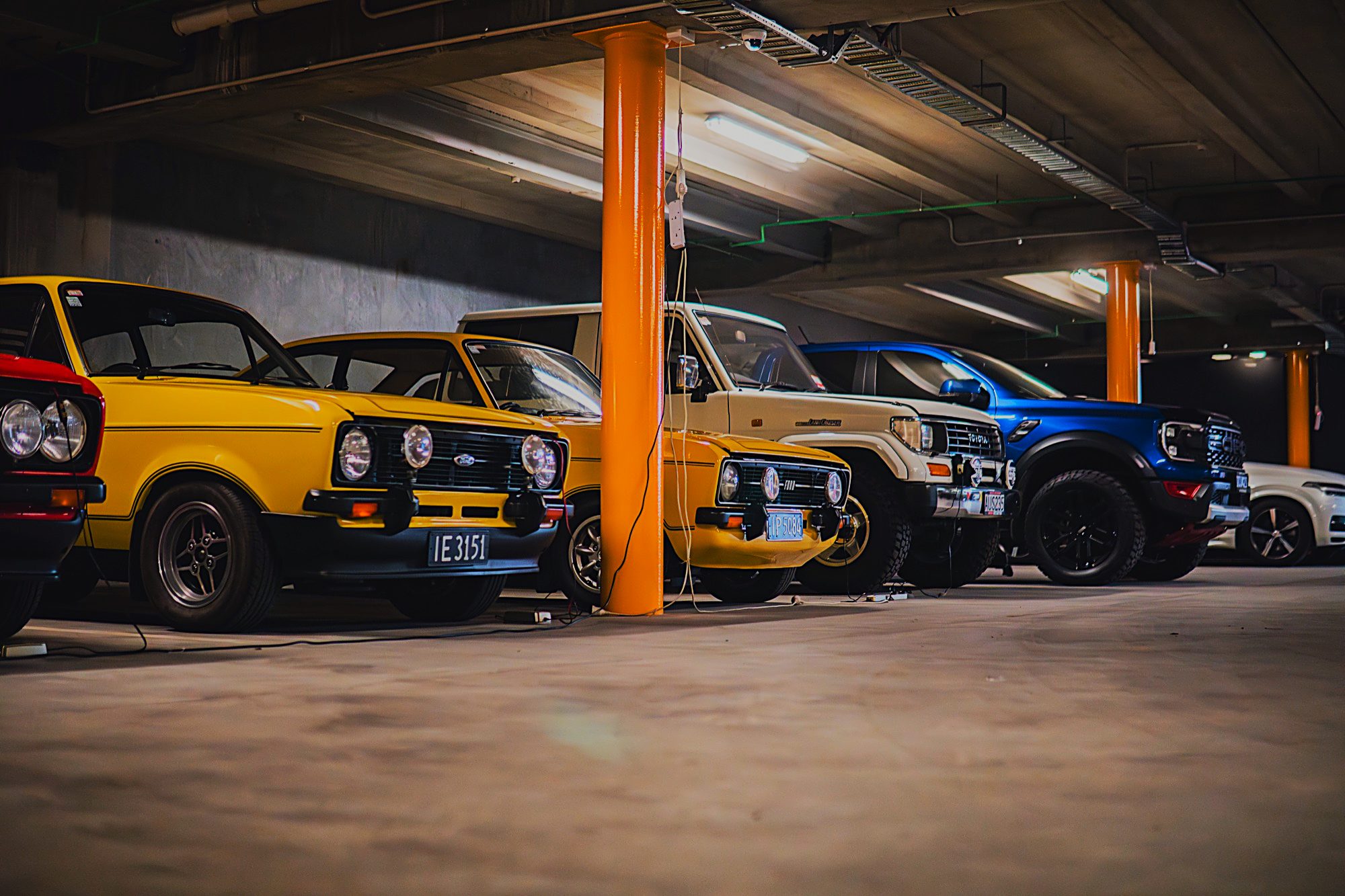 Lineup of classic and modern vehicles in secure storage